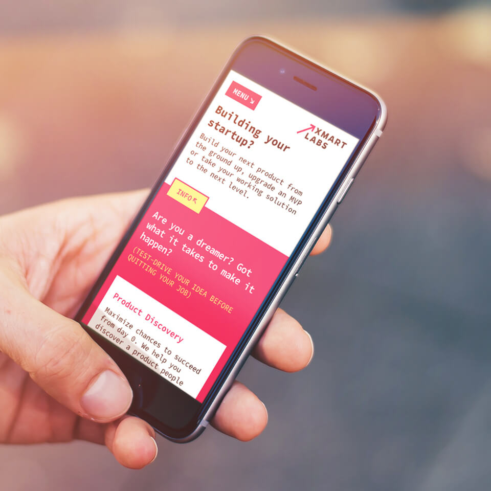 hand holding smartphone with website layout